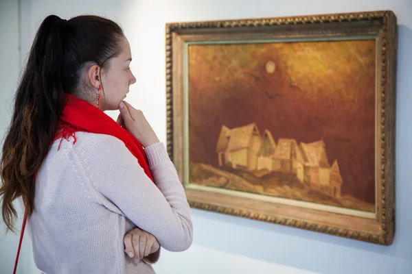 Girl looking at Bazovsky's painting, Slovakia — Stock Photo, Image