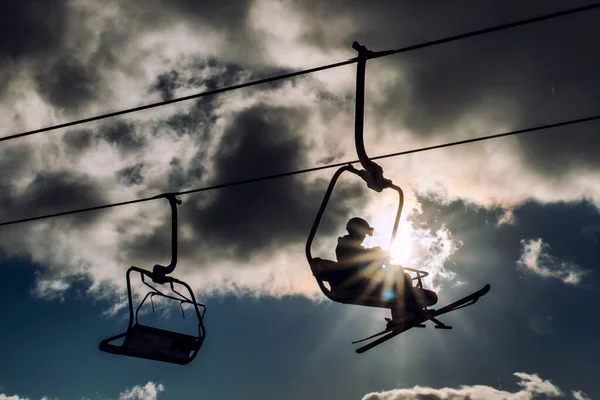 Silhouette Skiers Sitting Ski Lift Chairs Sky — Stock Photo, Image