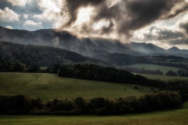 Dark clouds over mountain country. Sulov rocks in Slovakia.