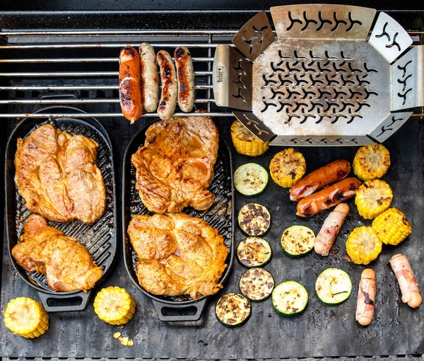 grill barbecue outdoors on the backyard. Bbq party. Grilled meat and vegetables