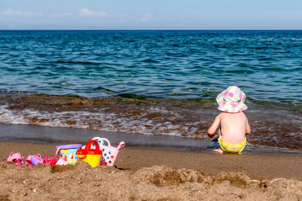 Small Child Hat Swimsuit Plaing Toys Sandy Beach Sea Background — Foto de Stock