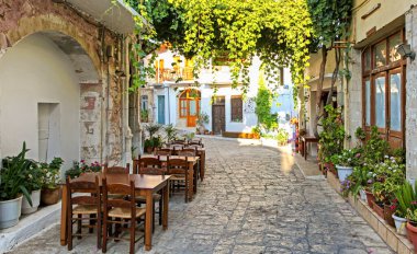 PANORMO, GREECE - SEPTEMBER 8, 2013: Empty small taverna in village Panormos at Crete island