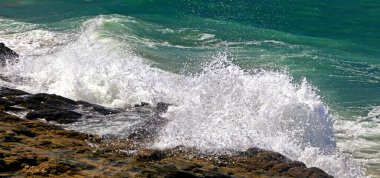 Waving sea on the coastline. Splash water. Stormy sea