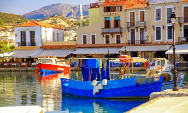 RETHYMNO, GREECE - SEPTEMBER 11, 2013: Fishing boats in port at town Rethymno in crete island at Greece