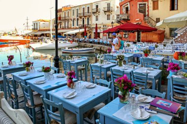 RETHYMNO, GREECE - SEPTEMBER 11, 2013: Tavernas and restaurants in old town in city Rethymno in Crete island at Greece