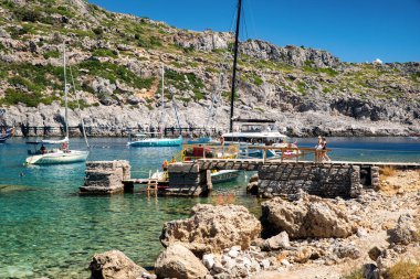 FALIRAKI, GREECE - JULY 4, 2022:Luxurios yachts in Anthony Quinn bay with crystal clear water in Rhodes island, Greece