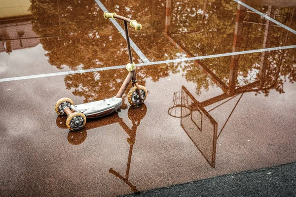 Reflection Children Scooter Puddle Playground Rainy Weather — 스톡 사진