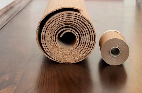 Roll of cork with Painting edging tape on a brown floor — Stock Photo, Image