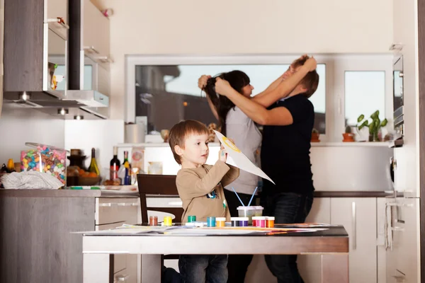 Little boy hearing his parents arguing in a kitchen — Stock Photo, Image