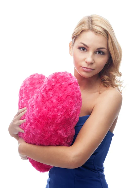 Ragazza con cuscino a forma di cuore — Foto Stock