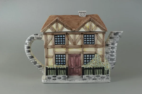 Porcelain teapot in the form of a house. — Stock Photo, Image