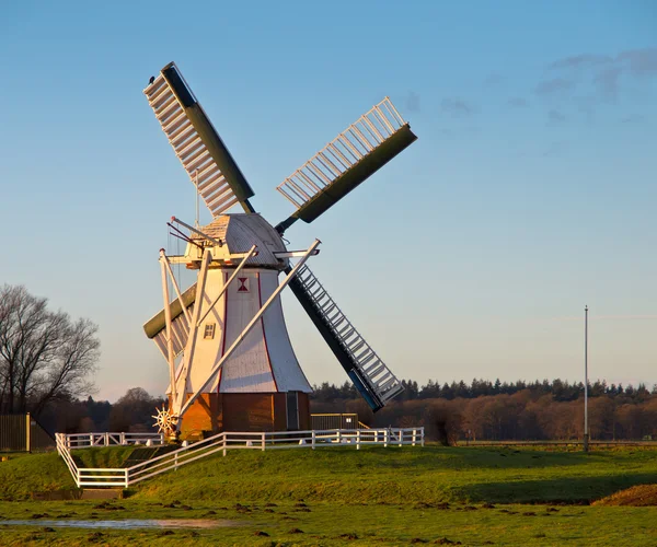 White windmill against blue sky — Stock Photo, Image