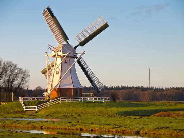 White windmill against blue sky — Stock Photo, Image