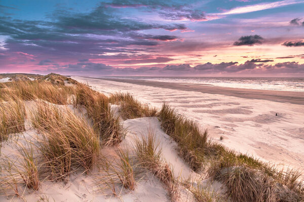 Sunset View from dune top over North Sea from the island of Ameland, Friesland, Netherlands