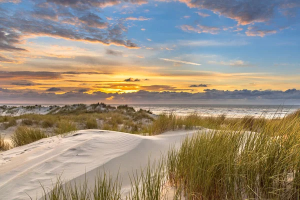 Sunset View from dune top over North Sea from the island of Ameland, Friesland, Netherlands