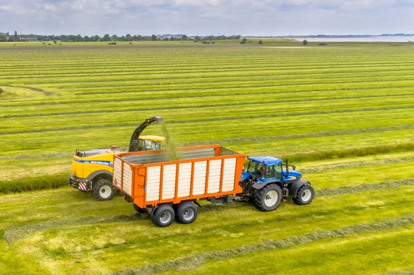 Tractor Harvester Fresh Mowed Green Agricultural Grassland Cloudy Summer Sky — Stock Photo, Image