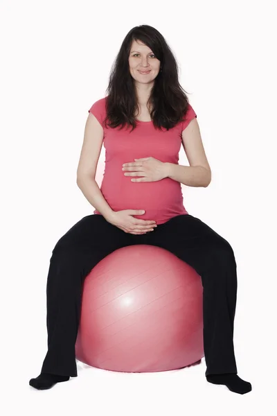 Pregnant woman sitting on the fitball — Stock Photo, Image