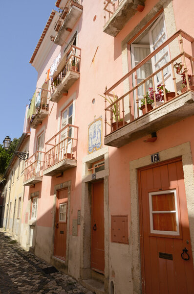 Pink street in the neighborhood of Alfama in Lisbon, Portugal