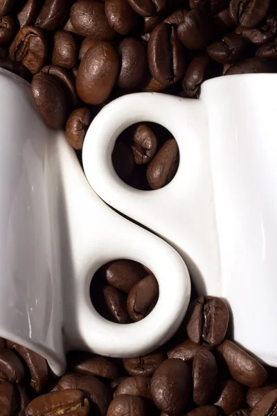 Copos nos grãos de café Imagem De Stock