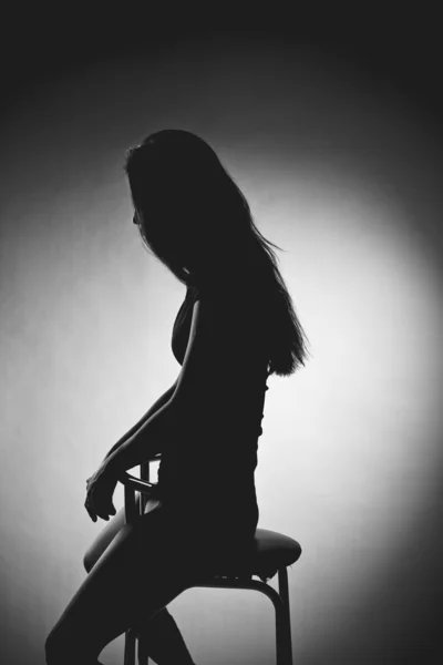 Erotic silhouette of a beautiful young woman Stock Photo