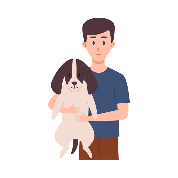 年轻男子牵着滑稽可爱的狗 平平的卡通矢量画面孤立在白色的背景上 供宠物照料和收养用的动物和主人卡通人物 — 图库矢量图片