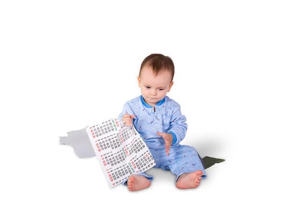 Child tearing the paper calendar — Stock Photo, Image