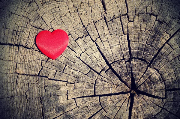 Vintage photo of red heart on a wooden background — Stock Photo, Image