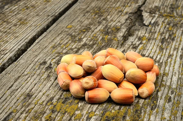 Hazelnuts on wooden background — Stock Photo, Image