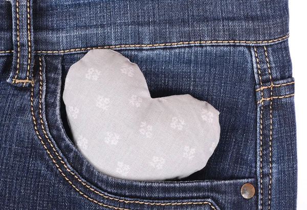 Gray heart shape in dark blue jeans pocket — Stock Photo, Image