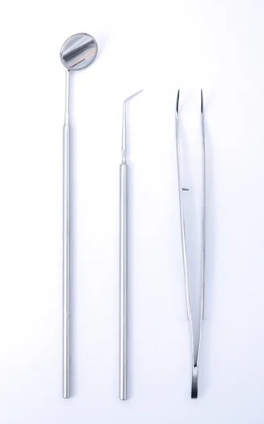 Row of various dental tools on white — Stock Photo, Image