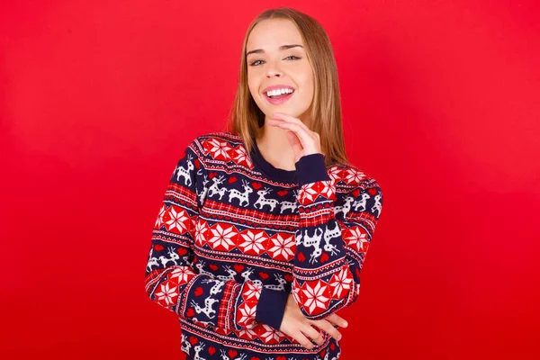 Optimistic Young Caucasian Girl Wearing Christmas Sweater Keeps Hands Partly — Stock Photo, Image