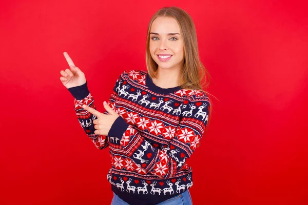 Young Caucasian Girl Wearing Christmas Sweater Indicating Finger Empty Space — Stock Photo, Image