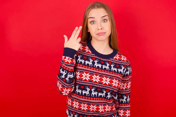 Unhappy Young Caucasian Girl Wearing Christmas Sweater Makes Suicide Gesture — Stock Photo, Image