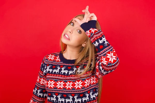 Young Caucasian Girl Wearing Christmas Sweater Making Fun People Fingers — Stock Photo, Image