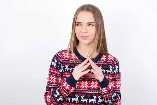 Young Caucasian Girl Wearing Christmas Sweaters White Background Steepls Fingers — Stock Photo, Image