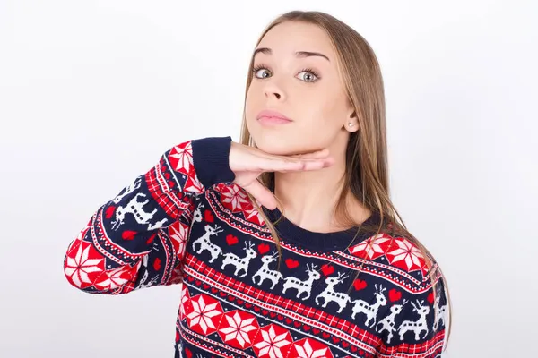 Young Caucasian Girl Wearing Christmas Sweaters White Background Cutting Throat — Stock Photo, Image