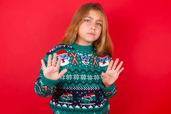 Afraid Funny Brunette Kid Girl Knitted Sweater Christmas Red Background — Stock Photo, Image