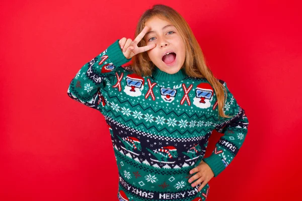 Funny Brunette Kid Girl Knitted Sweater Christmas Red Background Making — Stock Photo, Image