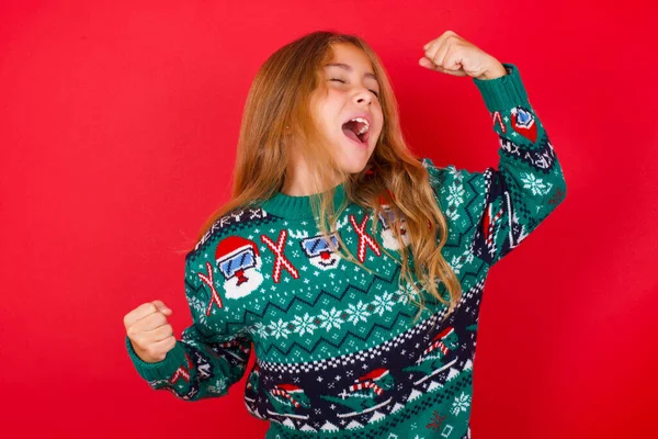 Attractive Brunette Kid Girl Knitted Sweater Christmas Red Background Celebrating — Stock Photo, Image