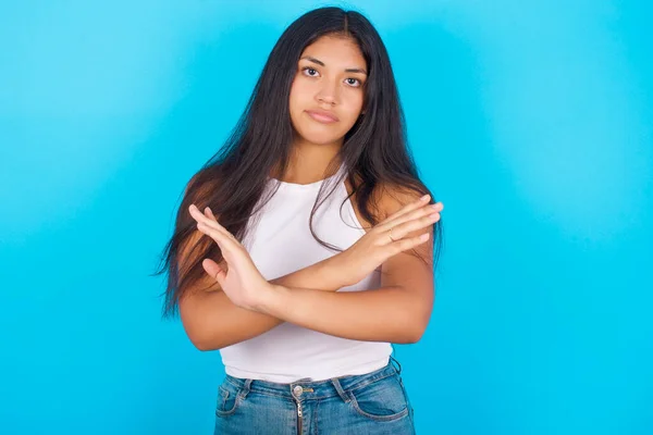 Young Hispanic Girl Wearing White Tank Top Blue Background Has — Fotografia de Stock