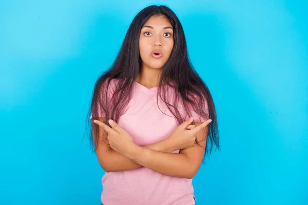 Confused Young Hispanic Girl Wearing Pink Shirt Blue Background Chooses — Foto Stock