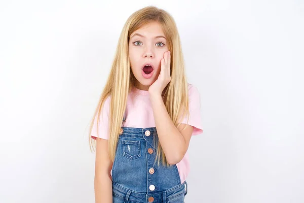 Shocked Beautiful Caucasian Little Girl Wearing Denim Jeans Overall White — Stock Photo, Image