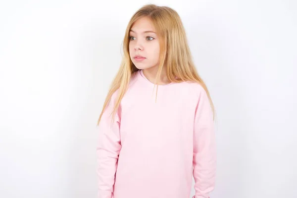 Beautiful Caucasian Little Girl Wearing Pink Sweater White Background Stares — Stock Photo, Image