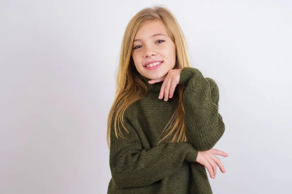 Optimistic Caucasian Kid Girl Wearing Green Knitted Sweater White Background — Stock Photo, Image