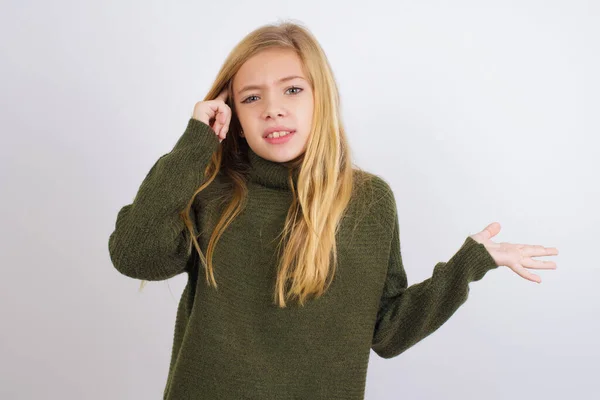 Caucasian Kid Girl Wearing Green Knitted Sweater White Background Confused — Stock Photo, Image