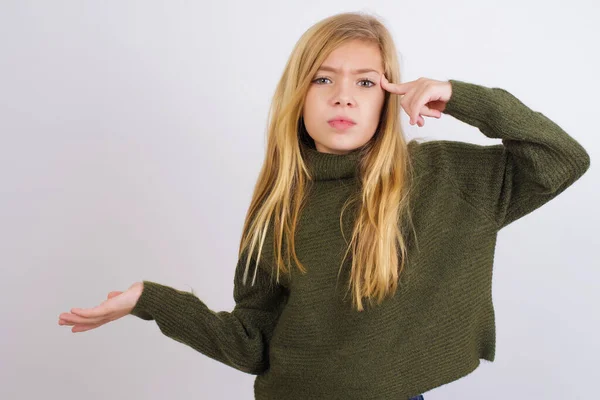 Caucasian Kid Girl Wearing Green Knitted Sweater White Background Confused — Stock Photo, Image