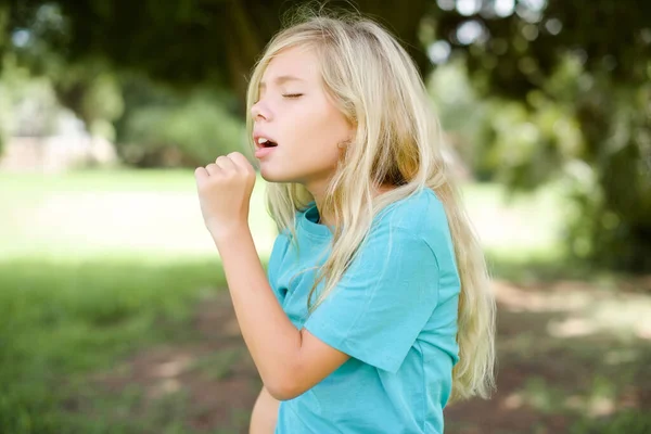 Caucasian Little Kid Girl Wearing Blue Shirt Standing Outdoors Feeling — Stock Photo, Image