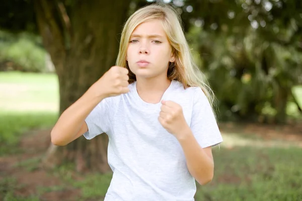 Displeased Annoyed Caucasian Little Kid Girl Wearing Whitet Shirt Standing — стокове фото