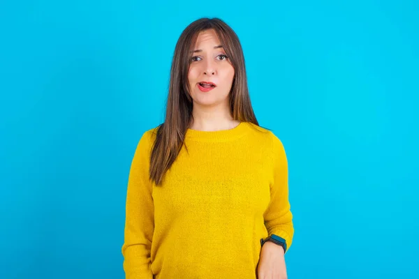Portrait Dissatisfied Young Arab Woman Wearing Yellow Knitted Sweater Blue — Stock Photo, Image
