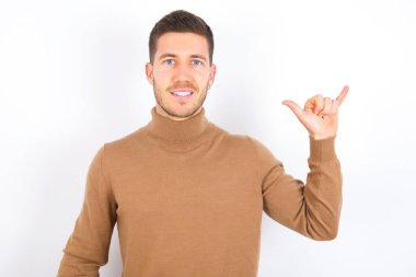 young caucasian man wearing turtleneck over white background showing up number six Liu with fingers gesture in sign Chinese language